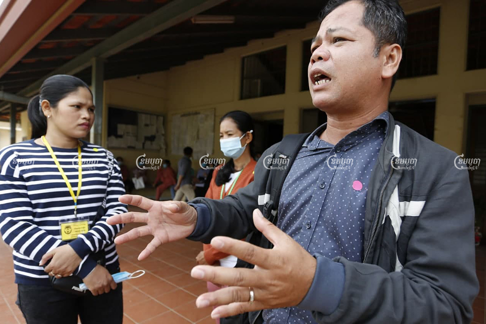 Phin Sophea, a representative for workers at the shuttered Dignity Knitter and ECO Base factories, explains how the sale of machinery seized from the factories fell though, in Kandal province on Tuesday. Panha Chhorpoan