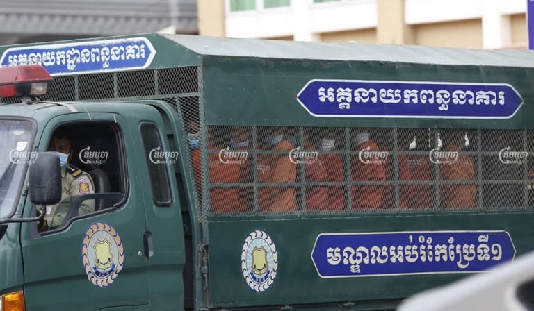 Former CNRP officials leave Phnom Penh Municipal Court in a prison truck on December 30 after being convicted on incitement charges related to Sam Rainsy’s failed plan to return to Cambodia in 2019. Panha Chhorpoan