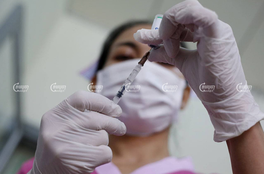 A doctor prepares Covid-19 vaccinations at a hospital in Phnom Penh on Thursday, February 25, 2021. CamboJA/ Pring Samrang