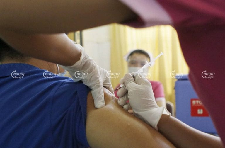 A man is vaccinated for Covid-19 at a hospital in Phnom Penh on Thursday, February 25, 2021. CamboJA/ Pring Samrang