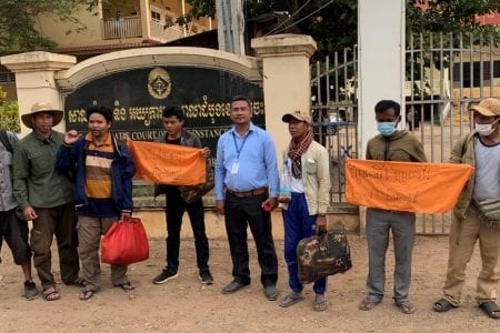 The five activists stand outside the Kratie Provincial Court with rights monitors and supporters, shortly after they were released Monday morning. Adhoc
