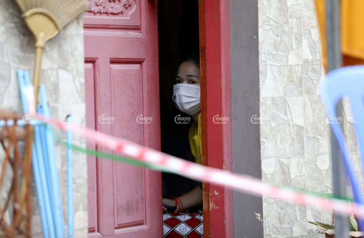 A garment worker is shown quarantined in her rental room after her roommate tested positive for Covid-19, on March 17, 2021. CamboJA/ Pring Samrang