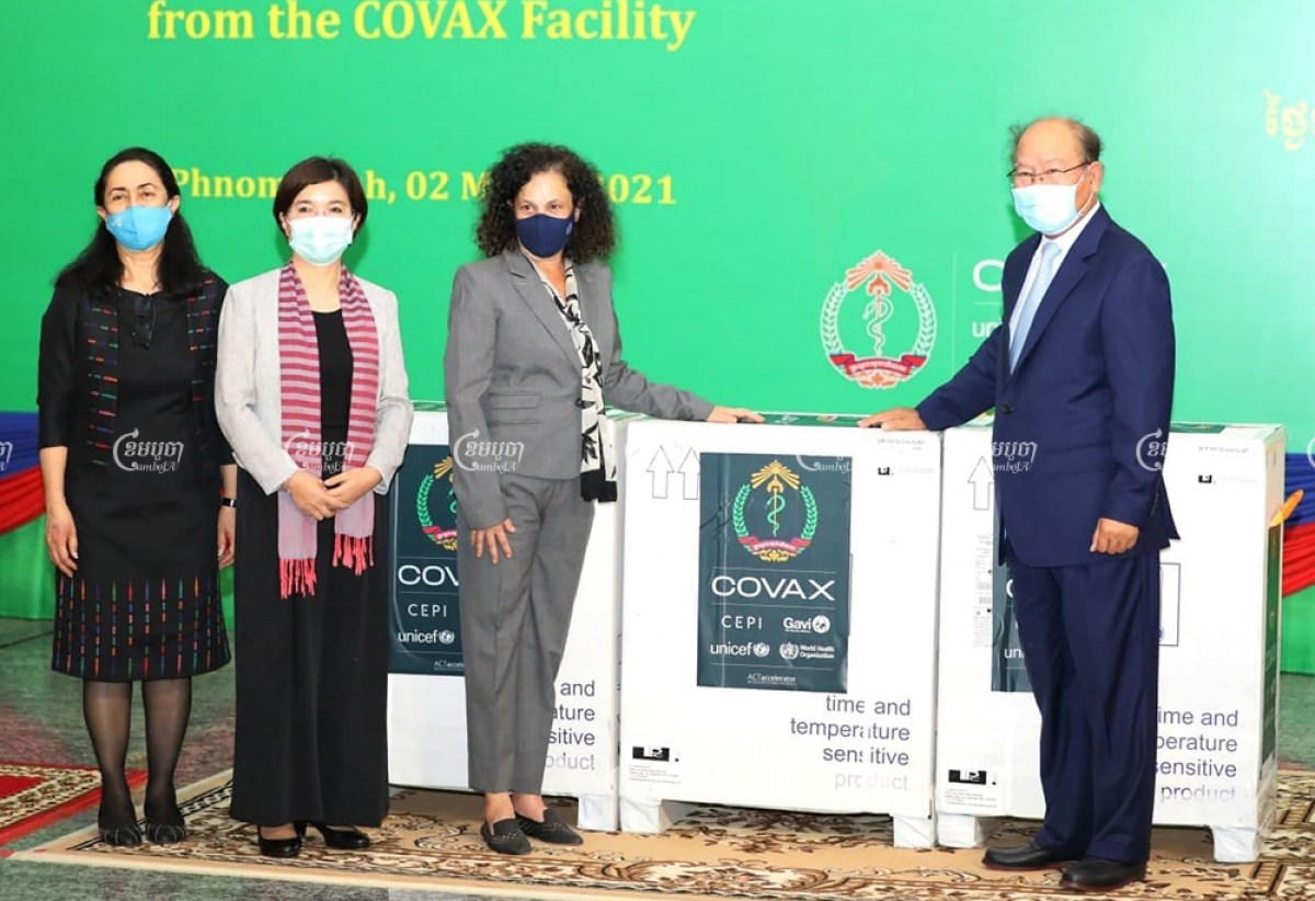 Representatives of WHO, UNICEF and the EU mission to Cambodia with Health Minister Mam Bun Heng at a ceremony to hand over COVID-19 vaccines acquired via the COVAX mechanism