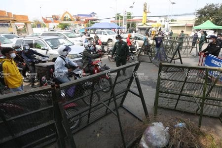Authorities block the street at the border of the Phnom Penh and Takhmao City, Kandal, on the first day of lockdown , April 15, 2021. CamboJA/ Pring Samrang