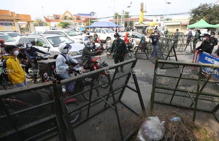 Authorities block the street at the border of the Phnom Penh and Takhmao City, Kandal, on the first day of lockdown , April 15, 2021. CamboJA/ Pring Samrang