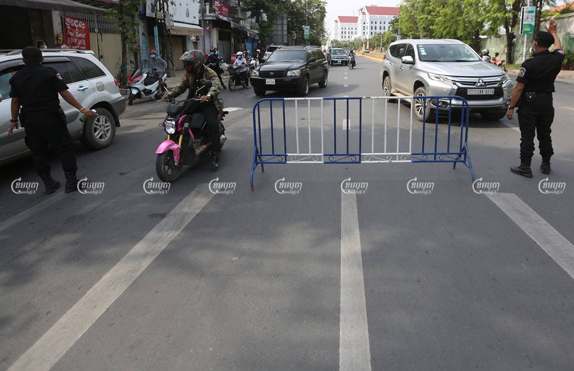 Authorities man a barricade in Phnom Penh after the two-week lockdown went into effect, April 15, 2021. CamboJA/ Pring Samrang