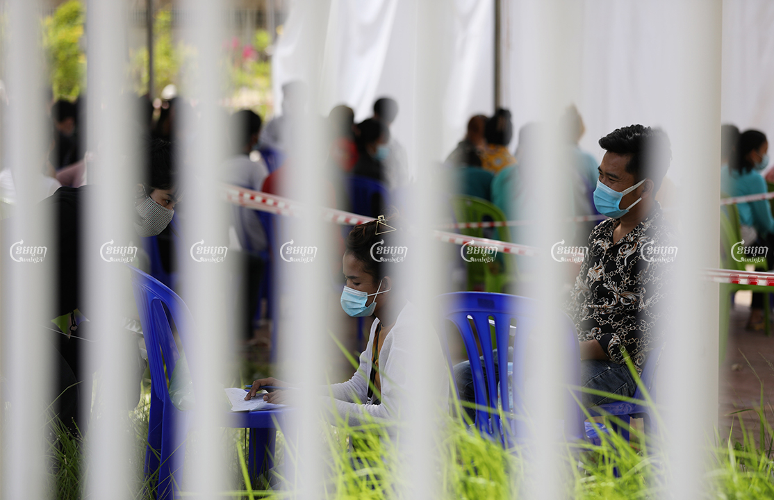 Residents from the red zone arrive at a COVID-19 testing center in Phnom Penh, April 24, 2021. CamboJA/ Pring Samrang