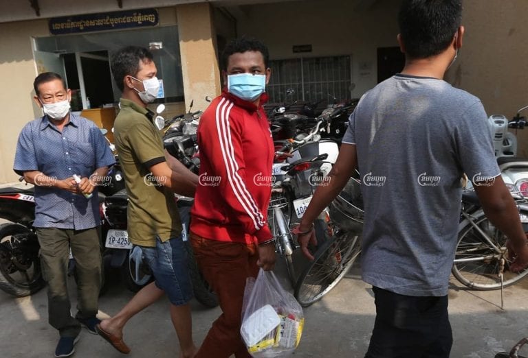 Three men arrive at Phnom Penh Municipal Court for questioning after they were arrested for allegedly violating the new COVID-19 law, April 7, 2021. CamboJA/ Pring Samrang