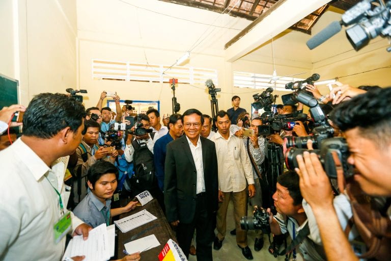 Kem Sokha, CNRP president, arrives at a polling center to vote during the 2017 commune election. CamboJA