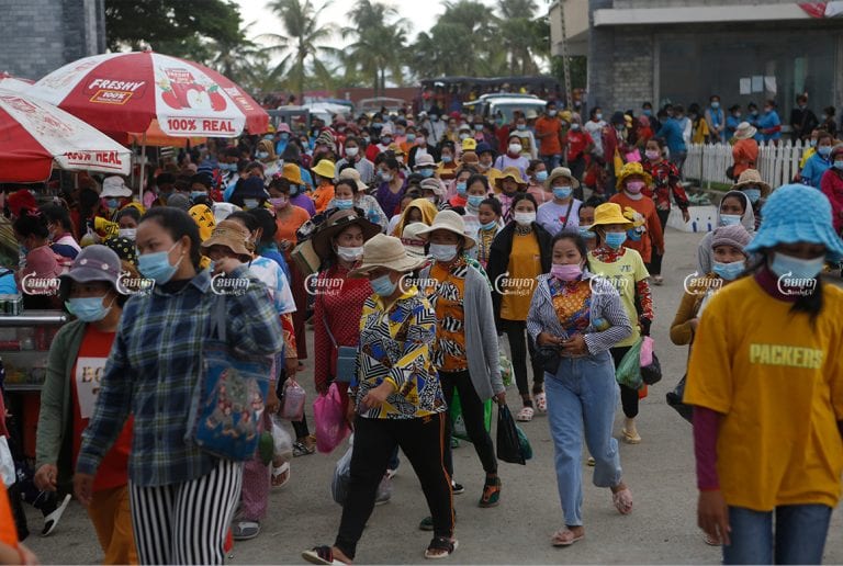 Garment workers leave a factory after finishing their day in the Kong Pisei district of Kampong Speu province on May 6, 2021. CamboJA/ Panha Chhorpoan