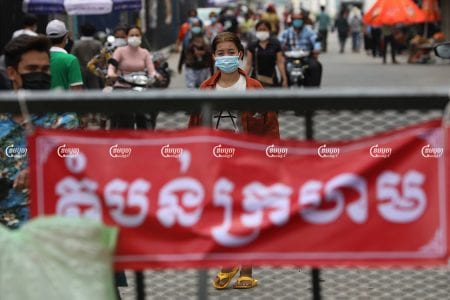 Garment workers leave after receiving a COVID-19 vaccination in a red zone in Choam Chao 1 commune, Pur Senchey District in Phnom Penh, May 12, 2021. CamboJA/ Pring Samrang