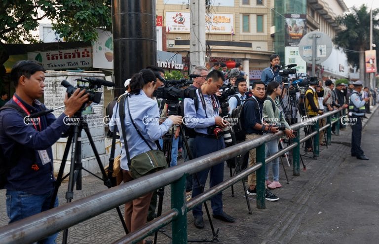 Journalists are forced together on one side of the street in front of the Phnom Penh Municipal Court during the hearing of former CNRP leader Kem Sokha on January 15, 2020. CamboJA/ Panha Chhorpoan