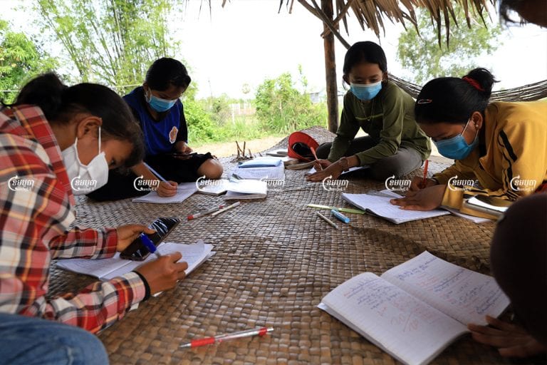 Students review lessons at home that their teacher sent via the Telegram messaging app in Krabey Real commune, Siem Reap province, May 7, 2021. CamboJA/ Panha Chhorpoan