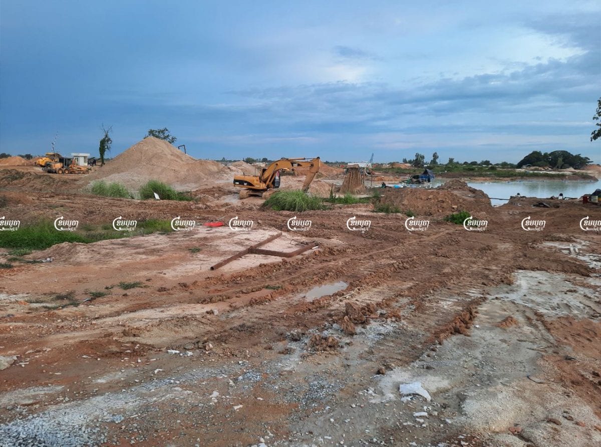 Company workers use excavators and bulldozers to prepare land for a new airport in Kandal province, June 15, 2021. CamboJA/ Panha Chhorpoan