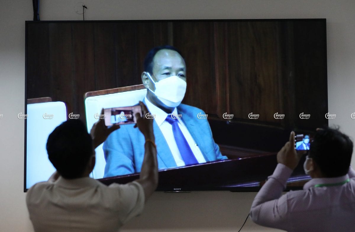 Prach Chan, the new chairman of the National Election Committee, is seen on live television at the National Assembly in Phnom Penh, June 24. CamboJA/ Pring Samrang
