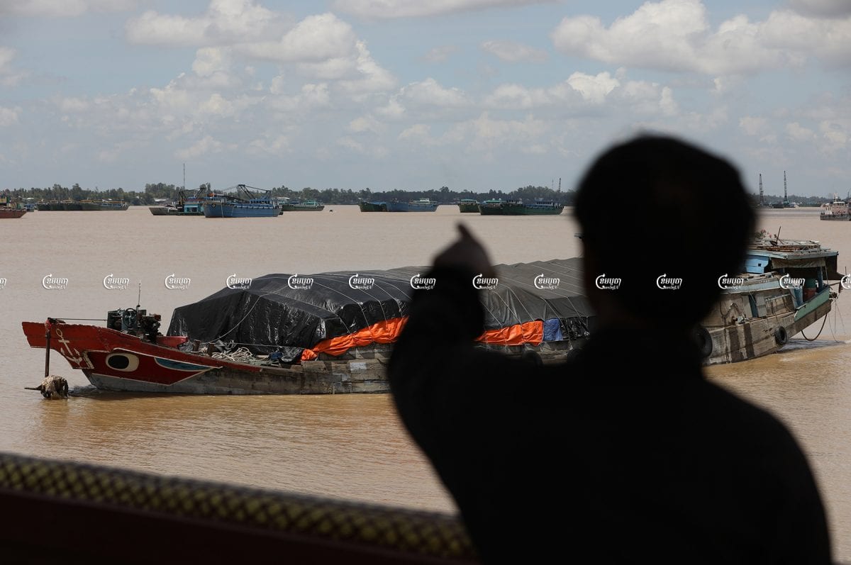 Vietnamese authorities use sand dredging boats to block the entry of floating houses through the aquatic border in the Mekong River at the Ka’am Samnor checkpoint of Cambodia, June 28, 2021. CamboJA/ Pring Samrang