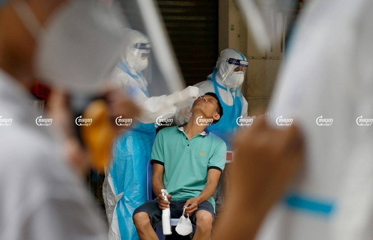 Health officials give Covid tests to residents in Phsar Touch village, Tuol Sangke 1 commune, Russei Keo district in Phnom Penh, which has recorded an outbreak of the Delta variant, August 2, 2021. CamboJA/ Panha Chhorpoan
