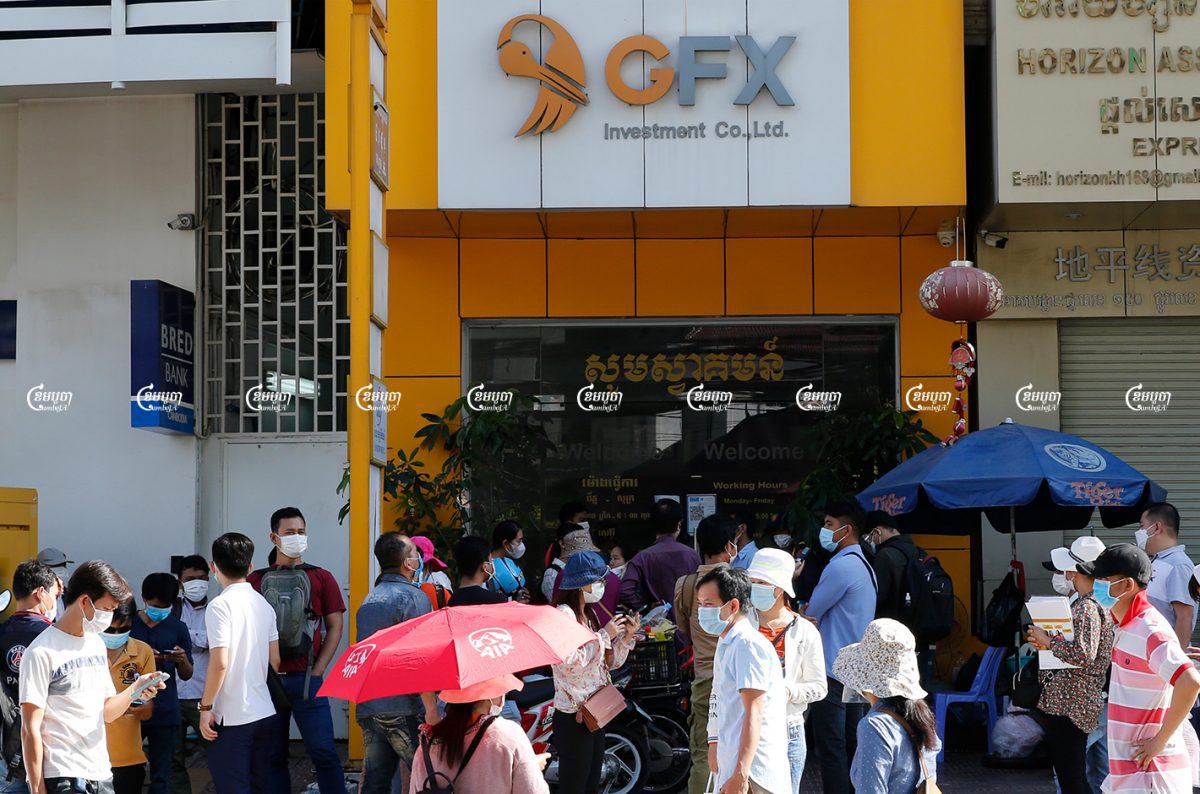 Investors gather in front of the GoldFX Investment Co., Ltd building in Phnom Penh to demand their money back after $27million was stolen from the investment fund, May 31, 2021. CamboJA/ Panha Chhorpoan