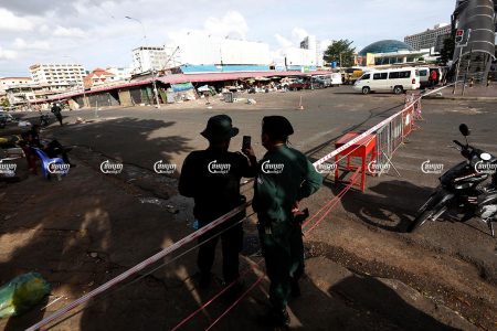 Police officers guard Doeumkor market in Tuol Kor district, which was closed down after a recent COVID-19 case was traced there, August 3, 2021. CamboJA/ Panha Chhorpoan