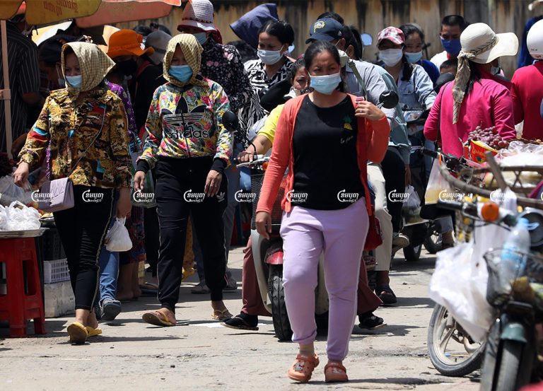 Garment workers leave for their lunch break from a factory on the outskirts of Phnom Penh, September 28, 2021. CamboJA/ Pring Samrang