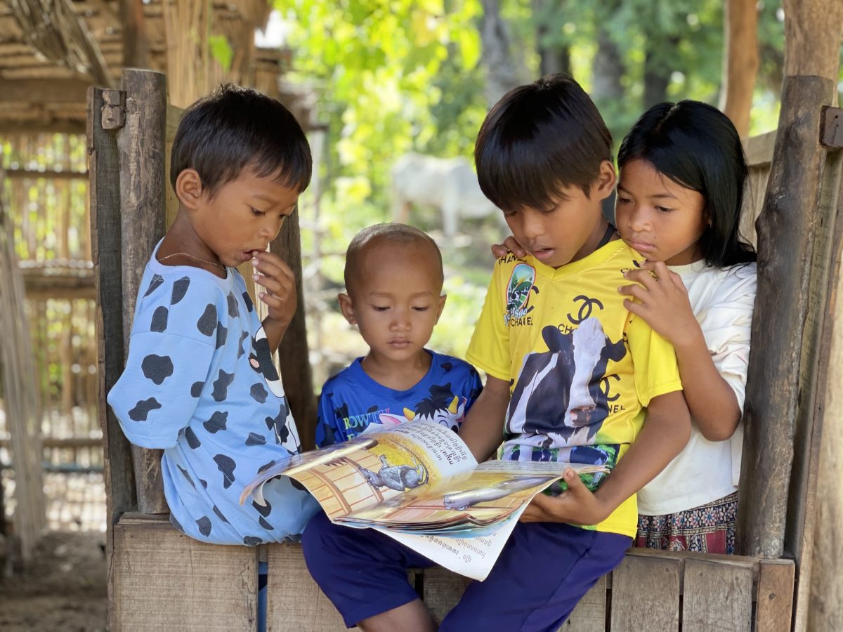 Children in the Baset district of Kampong Speu province read books borrowed from mobile libraries operated by the NGO World Vision. Photo taken September 7. World Vision