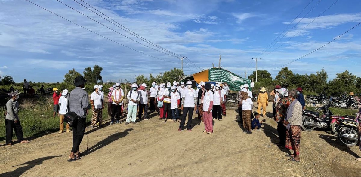 A journalist in the field covering a press conference held by villagers during an ongoing land dispute at the site of the massive planned airport in Kandal province on September 4, 2021. Photo Supplied