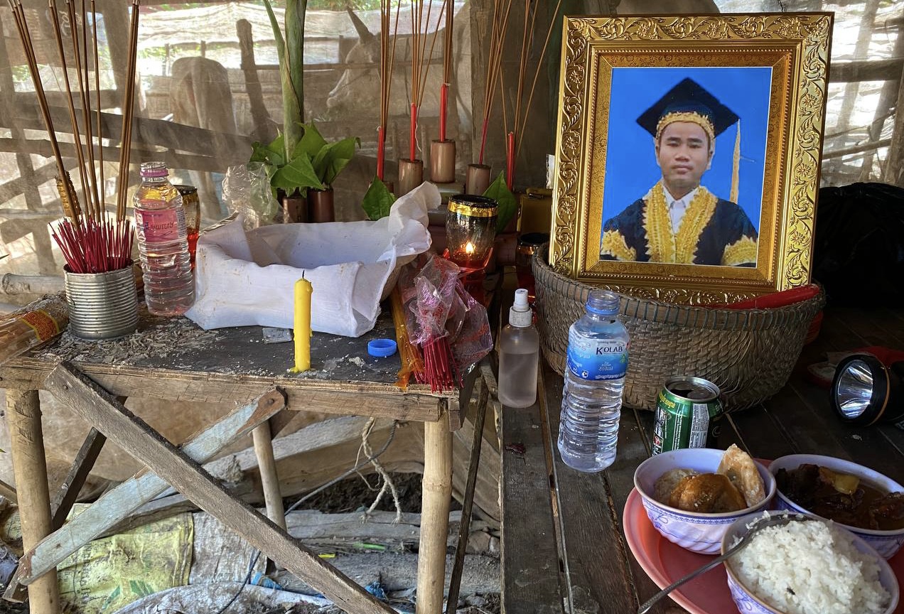 A portrait of the late Sin Khon, an activist associated with the former CNRP, is seen near his mother in Ta Keo province, November 23, 2021. Photo taken by Em Bunnarith