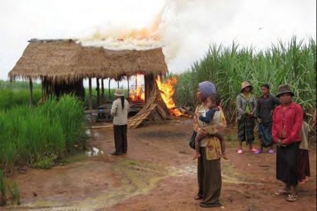 Oddar Meanchey provincial authorities set fire to people's houses on October 9, 2009 at O'Bat Moan point, Boss village, Kounkriel commune, Samraong district to make way for a Mitr Phol sugar plantation. Supplied