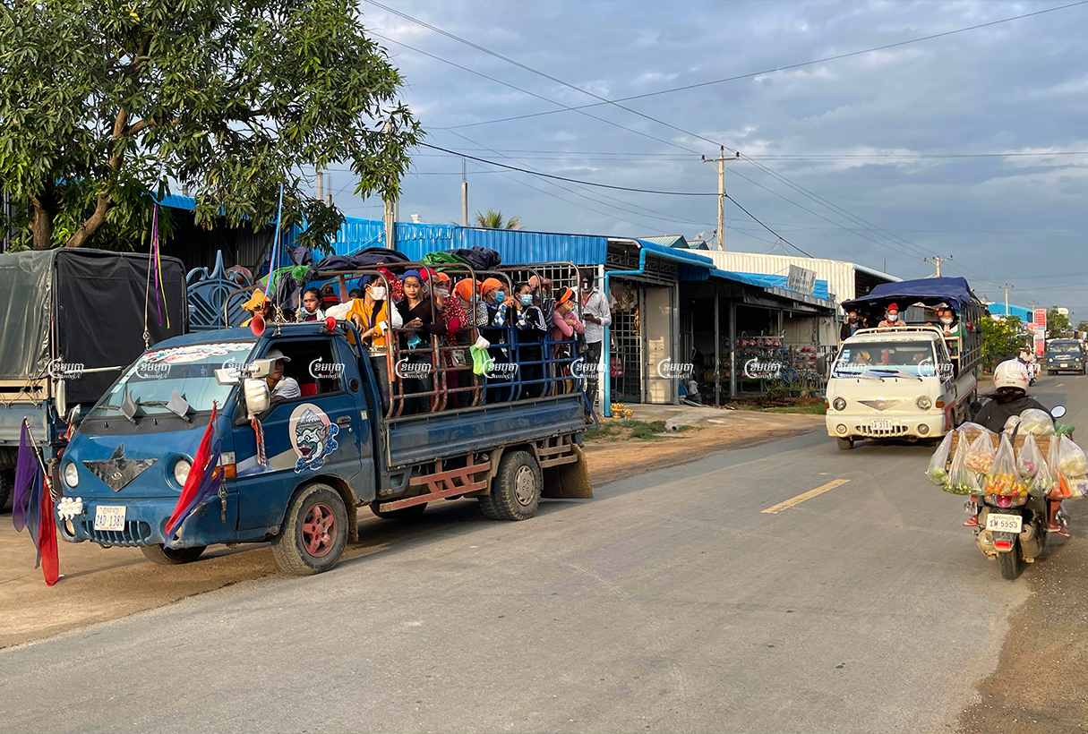 Garment workers riding on a truck in Kong Pisei district. Picture taken on October 2, 2021. Cambodia/ Pring Samrang