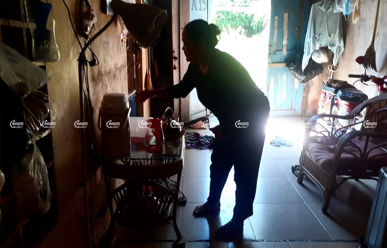 Muong Samnang cleans her home in the Chamkarmon district of Phnom Penh, December 8, 2021. CamboJA/ Chea Sokny