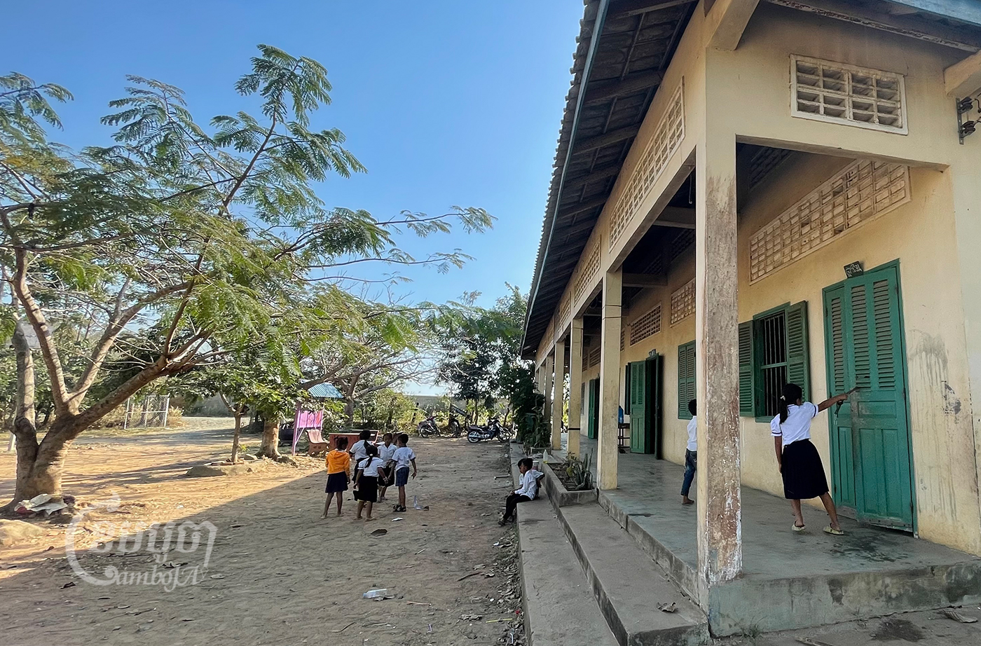 Students play at a school affected by the dust from Ly Yong Phat’s sugarcane factory in Kampong Speu province’s Oral district. Photo taken on January 18, 2022. CamboJA/ Khuon Narim