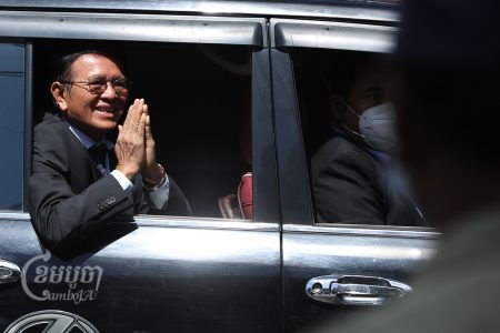 Kem Sokha greets supporters while leaving the Phnom Penh Municipal Court after attending his hearing on January 19, 2022. CamboJA/Pring Samrang