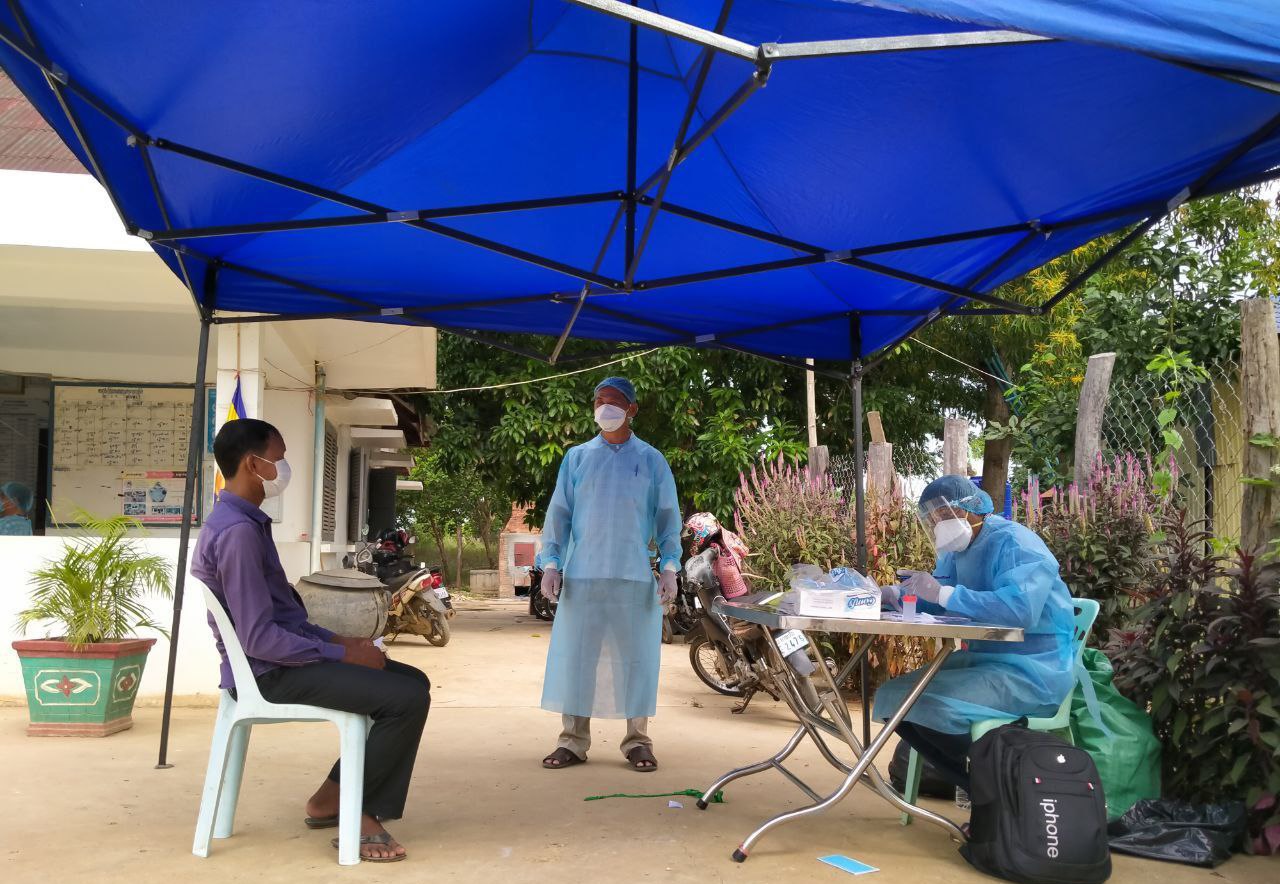 Health officials interview returned Cambodian migrant workers in August 2021. Supplied