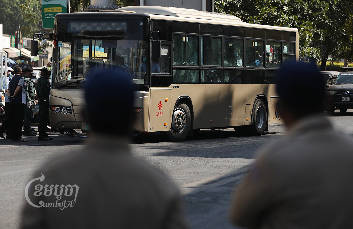 After officials forced striking NagaWorld employees into a bus, they took the workers to a quarantine center on the outskirts of the city, February 21, 2022. CamboJA/ Pring Samrang