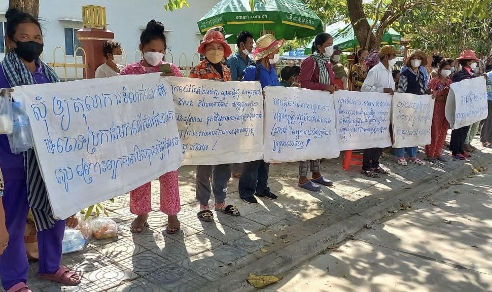 Villagers gather in front of Kampong Speu court to support their representatives, who were being questioned in court on February 23, 2022. CCFC
