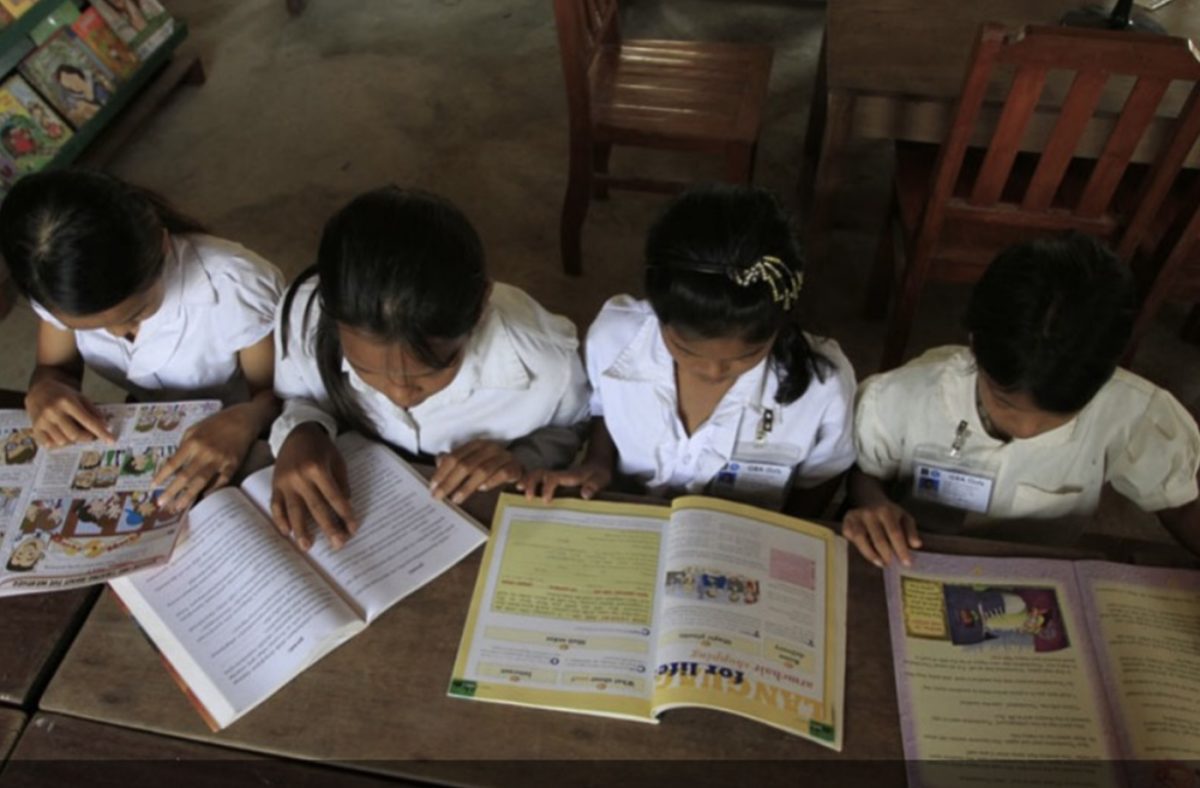 Kirivorn school students in Preah Sihanouk province reading books donated through JRfC-WAfC. Photo from JRfC-WAfC website.