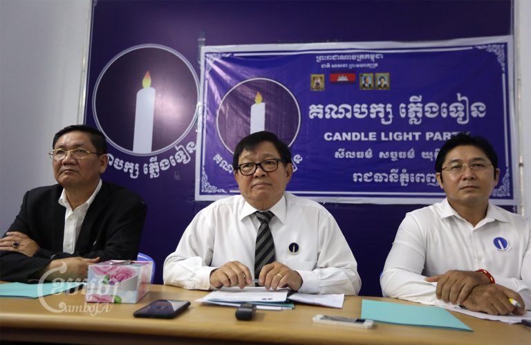 (From left) Candlelight Party vice presidents Thach Setha and Son Chhay, and general secretary Ly Sothearayuth at a press conference in Phnom Penh, April 4, 2022. CamboJA/ Pring Samrang