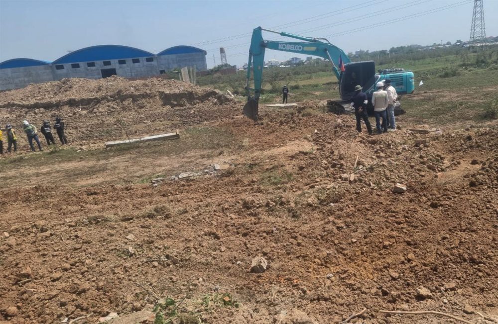 OCIC uses excavators to clear farmers’ land in Takhmao city to expand a road to the new airport, photo taken on April 8, 2022. Supplied