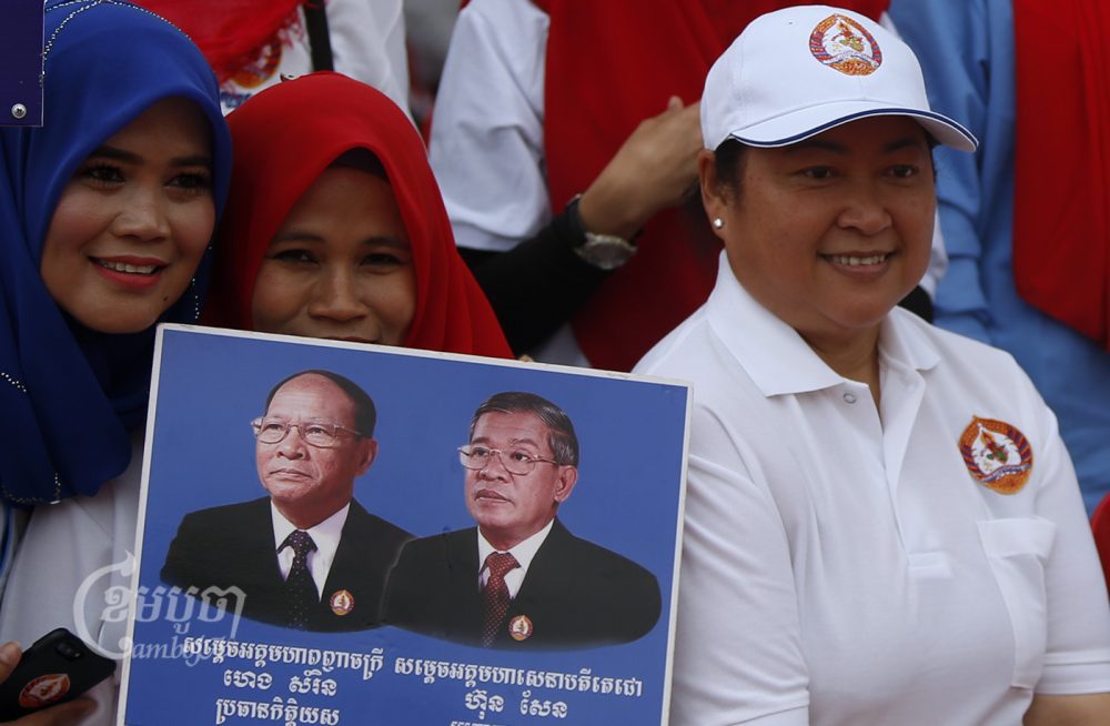 Hun Sen's protocol staffer, Song Leng Bora (R), attends the election campaign in Phnom Penh, Picture taken July 7, 2018. CamboJA/ Pring Samrang