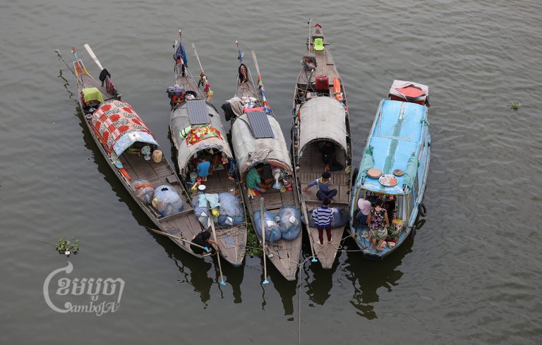Cham fishermen stay on a boat on the Tonle Sap river in Phnom Penh. Picture taken June 2, 2021. CamboJA/ Pring Samrang