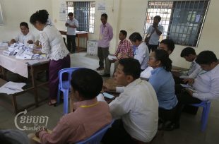 Observers monitor as members of the National Election Committee count ballots for a senate election in Phnom Penh. Picture taken February 25, 2018. CamboJA/ Pring Samrang