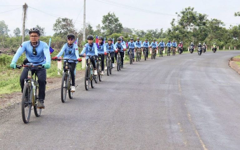 A group of environmental activists take part in a 600 km cycling event in O’Por village, Romney commune, Rovieng district, Preah Vihear province on May 11, 2022. Photo: World Environment Day Festival - Cambodia