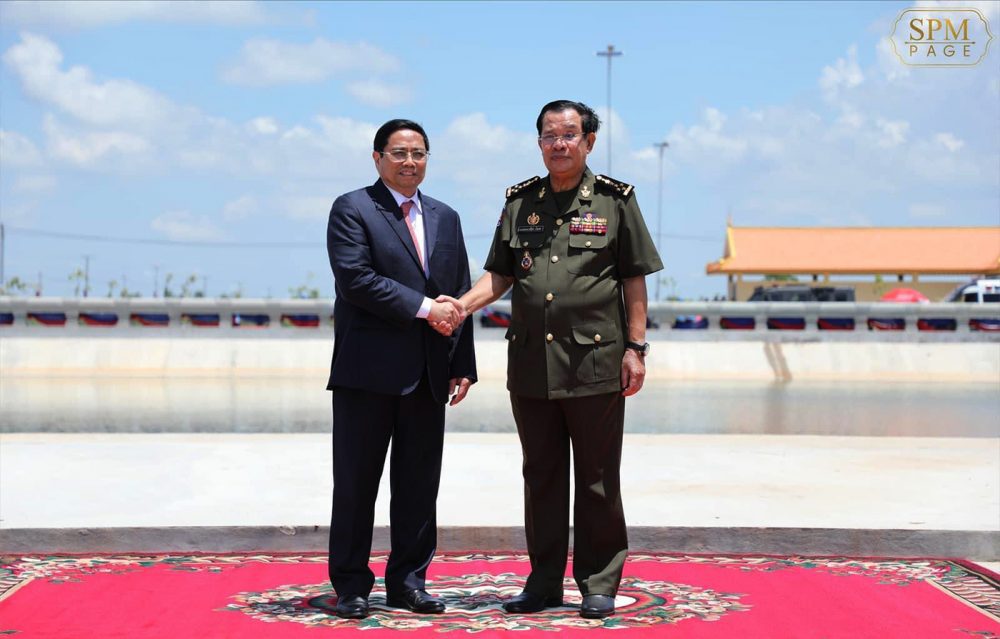 Cambodia's Prime Minister Hun Sen and Vietnamese Prime Minister Phạm Minh Chính shake hands in Tbong Khmum province during the 45th anniversary of Hun Sen's journey to Vietnam in 1977 to topple the Khmer Rouge. Photo taken on June 20, 2022. Picture from FB page of Hun Sen