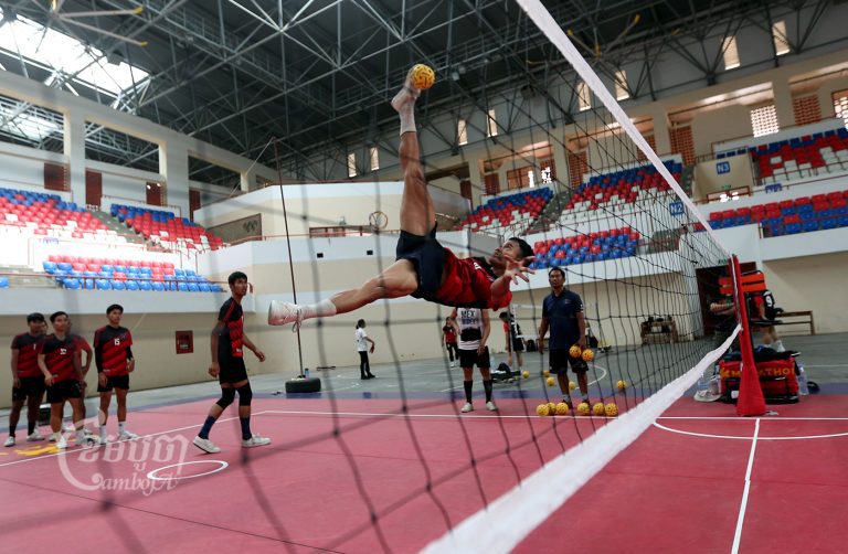 Sepaktakraw players train for the 32nd Southeast Asian Games at the Morodok Techo Stadium in Phnom Penh. The games will be held May 5–16, 2023, in Cambodia. Picture taken July 15, 2022. CamboJA/ Pring Samrang