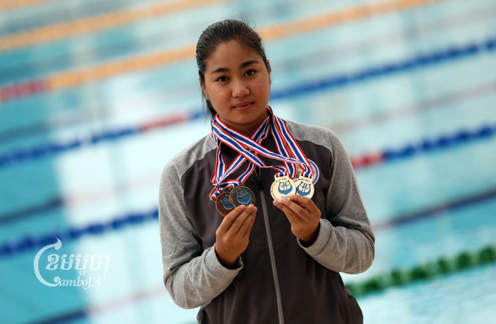 Kaing Muynin, a 16-year-old finswimmer on the Cambodian national team, shows her medals at Olympic Stadium in Phnom Penh on September 12, 2022. CamboJA/Pring Samrang