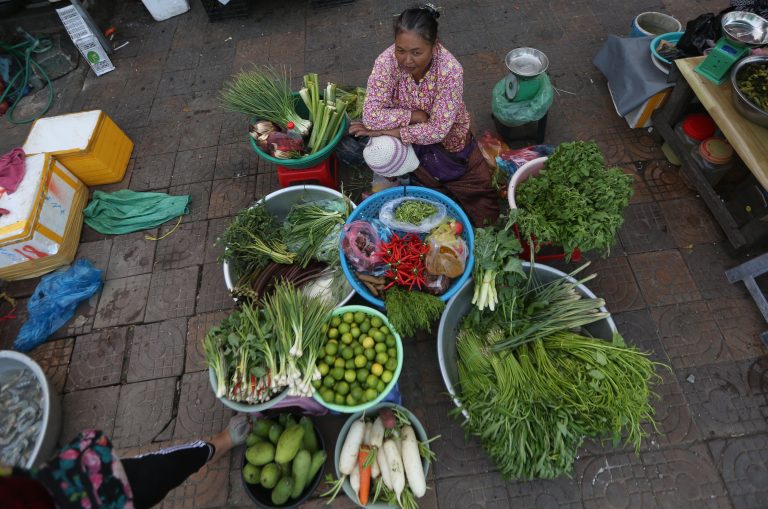 A vendor sells vegetables at a market in Phnom Penh in February 2021. CamboJA/ Pring Samrang