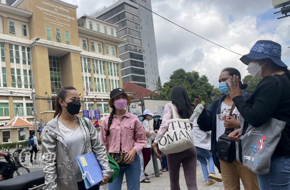 Four NagaWorld strikers leave Phnom Penh Municipal Court on October 17, 2022, after submitting a request to delay their court appearance in response to a lawsuit filed against them by their employer, NagaCorp. CamboJA/ Pring Samrang