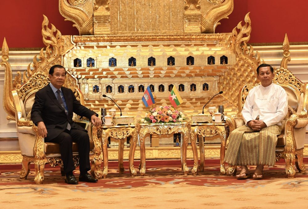 Prime Minister Hun Sen (left) is welcomed by Myanmar military leader Min Aung Hlaing during a meeting in Myanmar on January 7, 2022. (CamboJA/ Supplied: National Television of Cambodia)