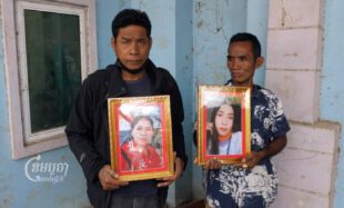Heang Bunnoeun (left) and Ban Doch (right) hold photos of their missing relatives, Bunnoeun’s sister-in-law Oeur Thy and Doch’s niece Sam Sreymom, on December 30, 2022. (CamboJA / Jack Brook)