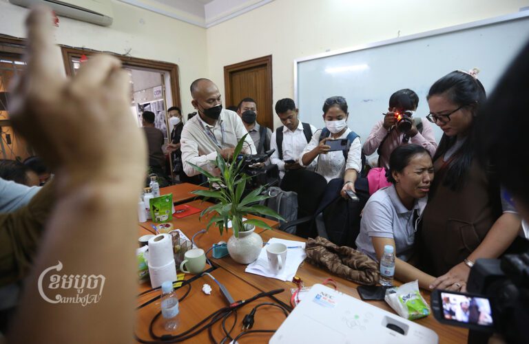 A VOD reporter cries at her last day of work in the newsroom’s office on February 13, 2023. (CamboJA/Pring Samrang)